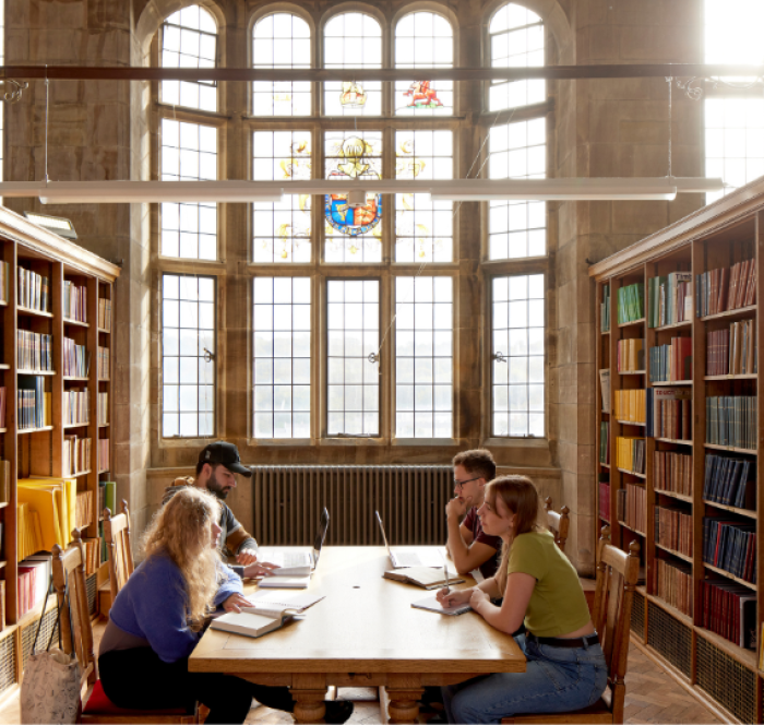 A group of four students study regarding the brief history of the English