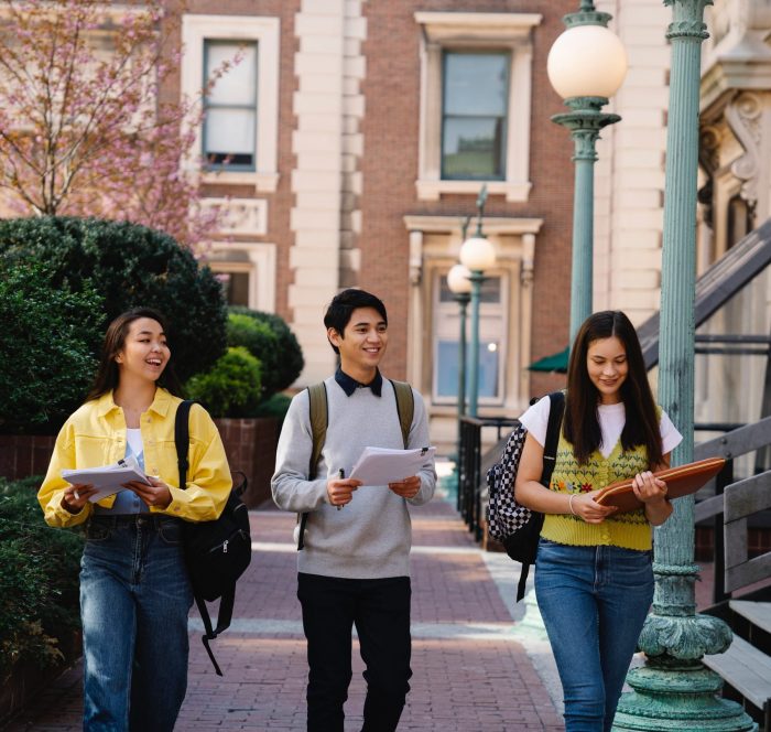 group of students are walking in OIEG campus