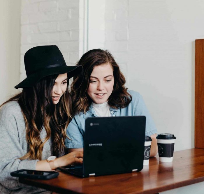 female students are using laptop searching can could may