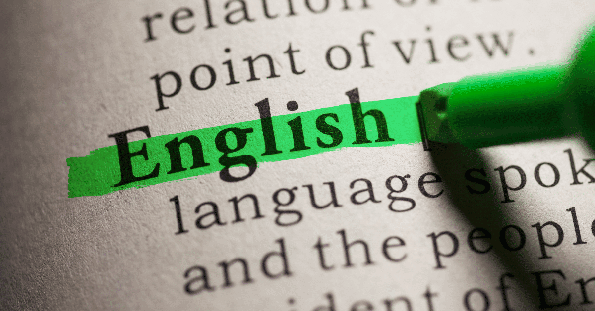 The word 'English' is highlighted on a page of text. Learn the differences between British vs. American English. Study with Oxford International English Schools today!